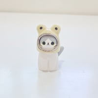 Image 1 of Gray and white cat with frog hat ceramic figurine (white gold version)