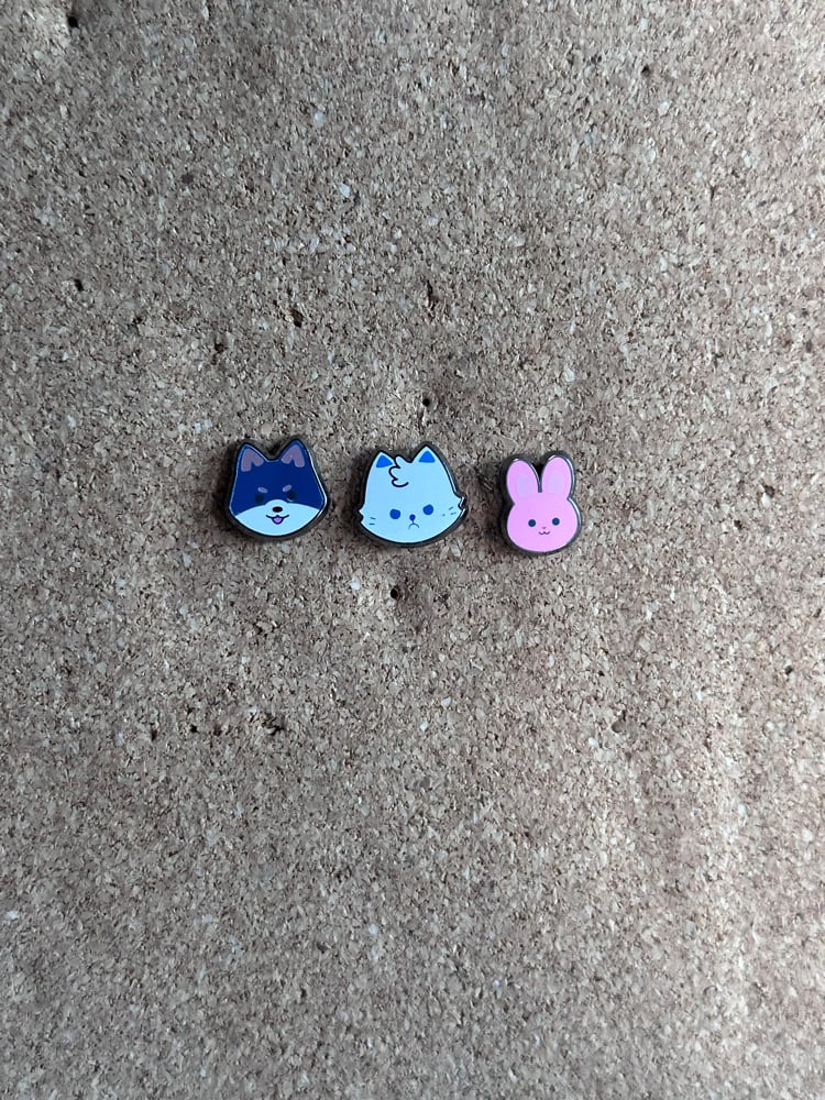 Image of trio chibis in hand 