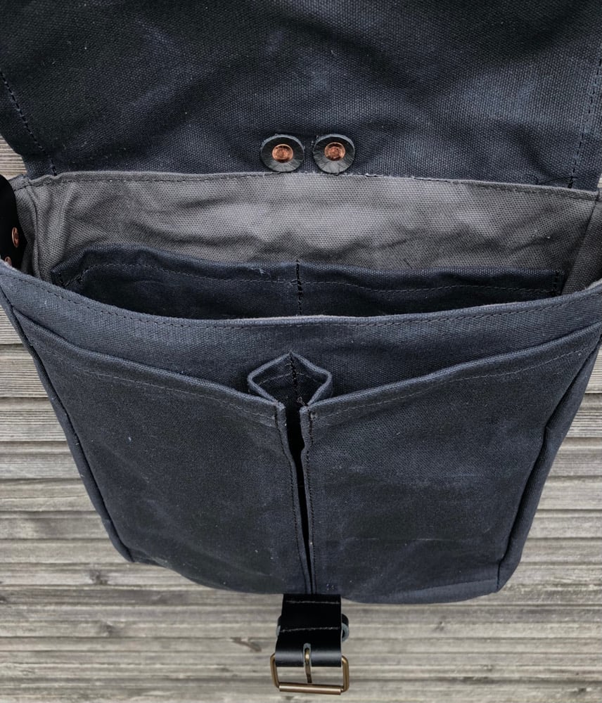 Image of Mens messenger bag in waxed canvas with leather adjustable shoulder strap and closing flap