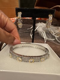 silver and gold earrings and bracelet set 