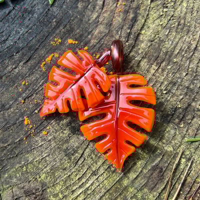 Image of Double Orange Sunburst Monstera Leaf Pendant