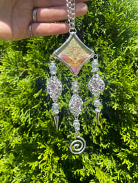 Image 1 of pressed orchid sun catcher