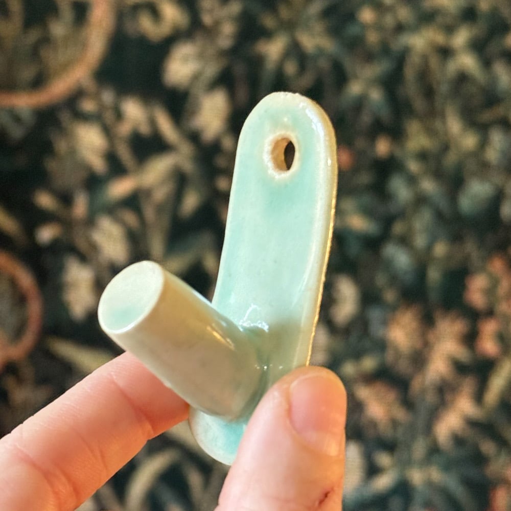 image of single hook wall hangers 