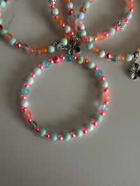Image 5 of Pastel Beaded Tumbler Bracelet Stack – Pink, Teal & Floral Charm Cup Accessories Set