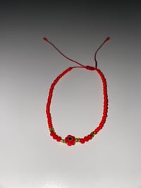 Image 1 of Red flower evil eye bracelet 