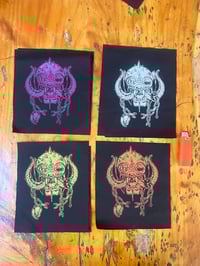 Image 1 of Snaggletooth patches 