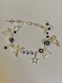 Image 2 of black and white cluttered bracelet