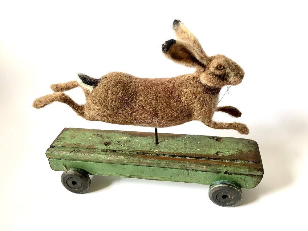 Image of Running Hare on green plinth. Vintage Collection.