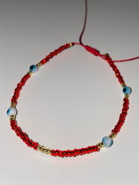 Image 2 of Teal evil eye red bracelet 