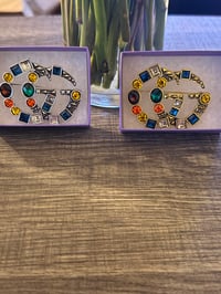 Gaudy G Brooch