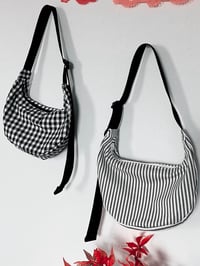 Image 1 of black and white crescent bags