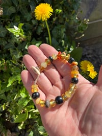 Image 1 of Amber and Jet mixed beads. 