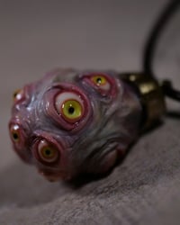 Image 3 of Egg of the King pendant, leather cord, brass hardware, all seeing glowing eyes