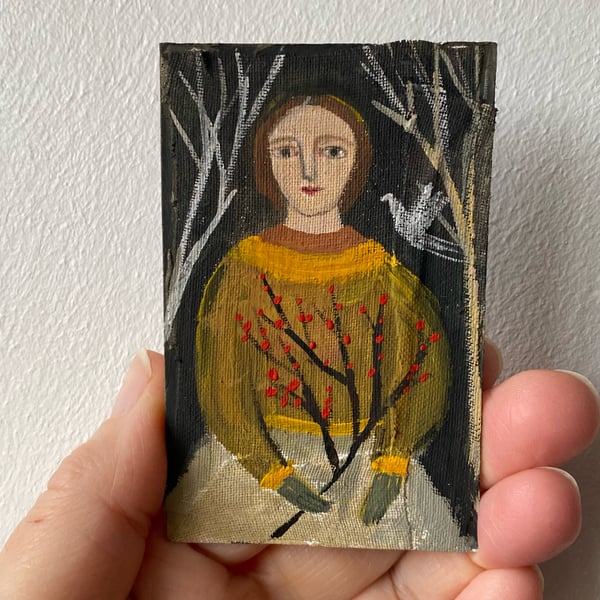 Image of Woman in yellows with berry branches - tiny portrait 