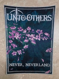 Image 1 of MUST GO TRACKED Official Unto Others - “Never, Neverland” Backpatch