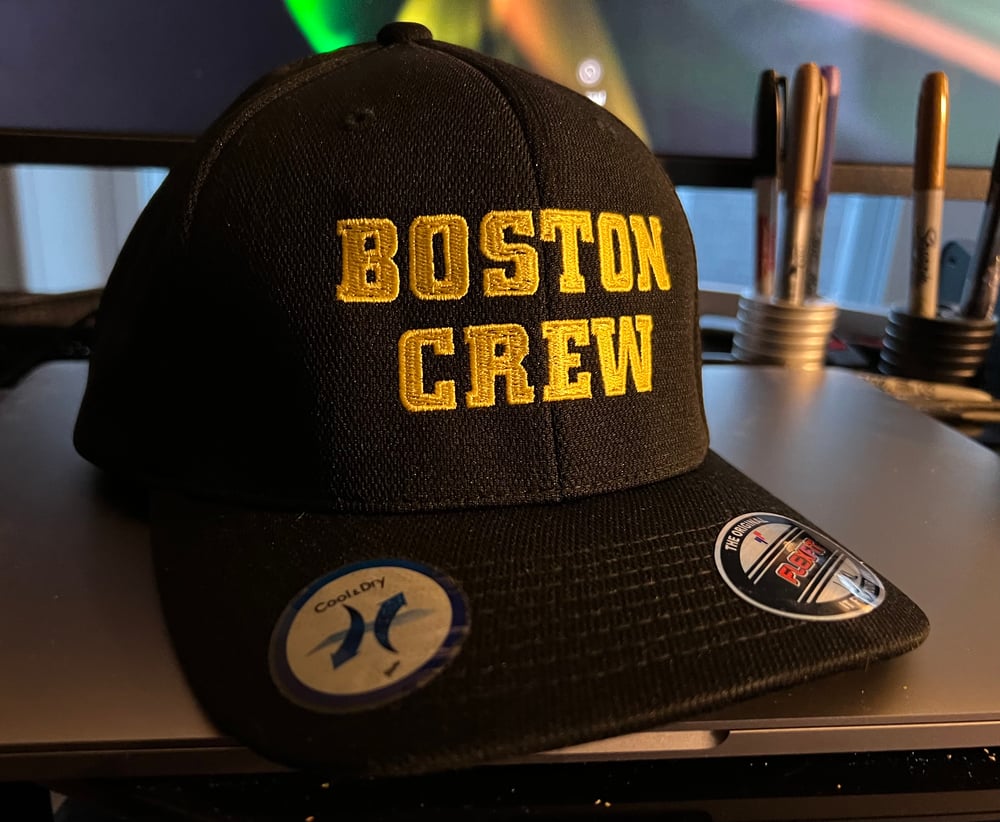 Black Flexfit hat with yellow “Boston Crew" Logo