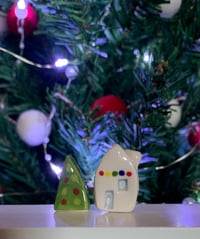 Image 7 of Little House with lights and a Christmas Tree.