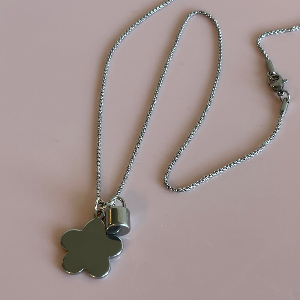 Image of Silver flower and barrel lock necklace