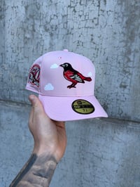 Image 1 of PASSION PINK PARTLY CLOUDY BALTIMORE ORIOLES CUSTOM FITTED CAP