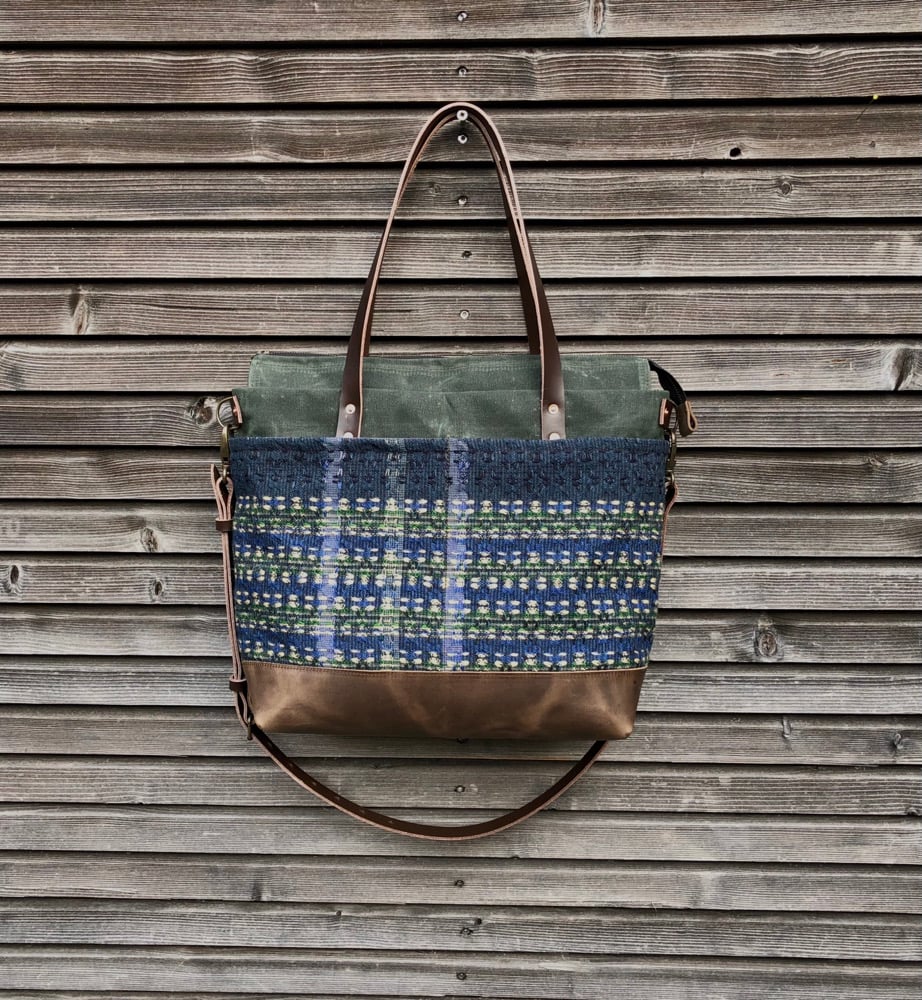 Image of  Waxed canvas carryall with handwoven exterior pocket in forest green