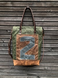 Image 3 of Vertical tote bag made  in waxed canvas with leather straps and cross body strap 