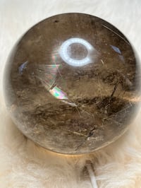 Image 16 of Golden Rutile In Smoky Quartz Sphere #1771