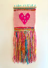 Candy yarn & a hot pink heart. Woven wall hanging.
