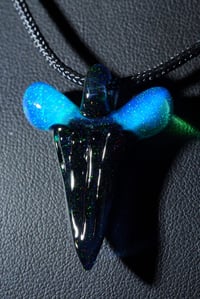 Image 2 of Fully crushed opal glass shark tooth pendant..