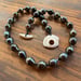 Image of Hand knotted Tahitian pearl necklace with puka shell clasp 18 inch