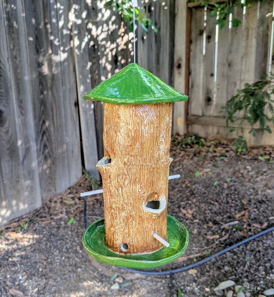 Image of handmade green and brown tall bird feeder 