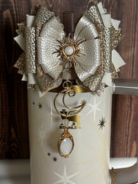 Image 2 of Starlight Shimmer Cream and Gold Sun, Moon, and Star Tumbler Straw Topper Bow