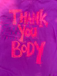 Image 1 of Gentle pink t shirt with orange fluro peachy text (2XL)