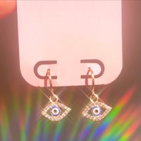 eye huggie earrings (in gold or silver)