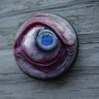 Image 12 of Custom Swappable Phone Grip for smartphones, bright blue reflective pupil, glow in the dark 