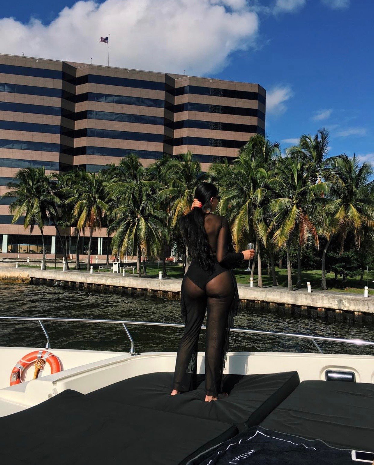 Image of BLACK SHEER BODYSUIT & FLARE PANTS (SMALL)