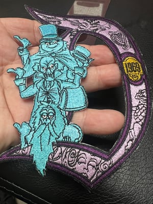 Image of 9” Haunted Mansion Disneyland “D” 1969 patch with iron on backing