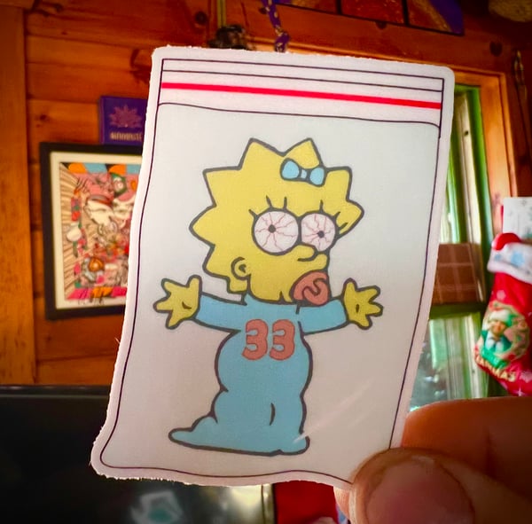 Image of Maggie in a baggie Sticker