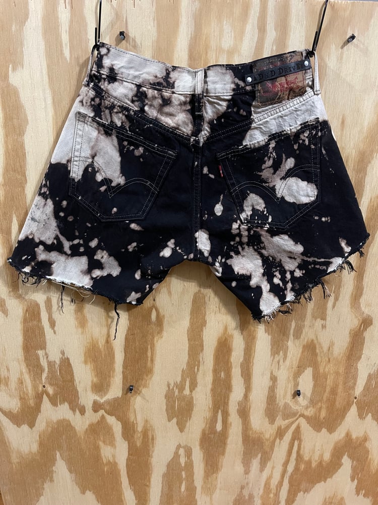 Image of Black splattered Levis 