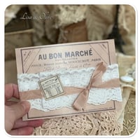 Image 1 of white lace trim on a vintage french stye postcard