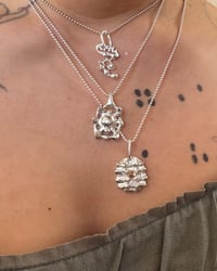 Image 2 of Lucky 4 grid charm with CZ gem 