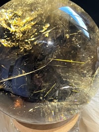Image 22 of Golden Rutile In Smoky Quartz Sphere #1769