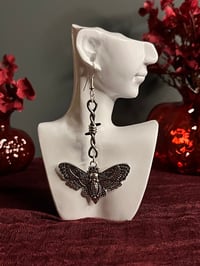 Image 1 of ‘A trapped moth’ earrings 