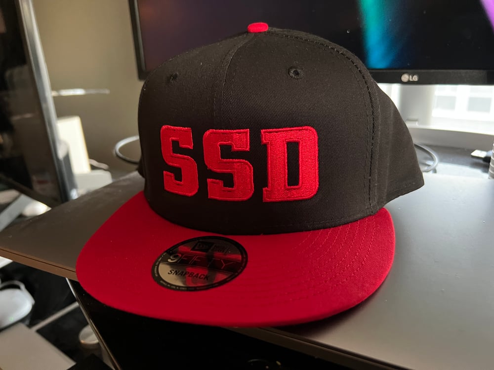 Black & Red New Era Flat Bill SnapBack Solid Red SSD Logo hat