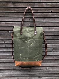 Image 2 of Vertical tote bag made  in waxed canvas with leather straps and cross body strap 
