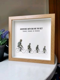 Image 1 of Dad &  3 children on bikes 
