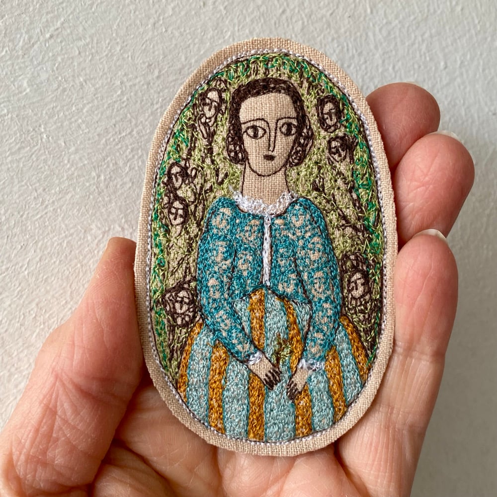 Image of portrait of a woman in turquoise and gold
