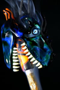 Image 2 of Dragon skull pendant with uv teeth & fire themed tip 🐲🔥