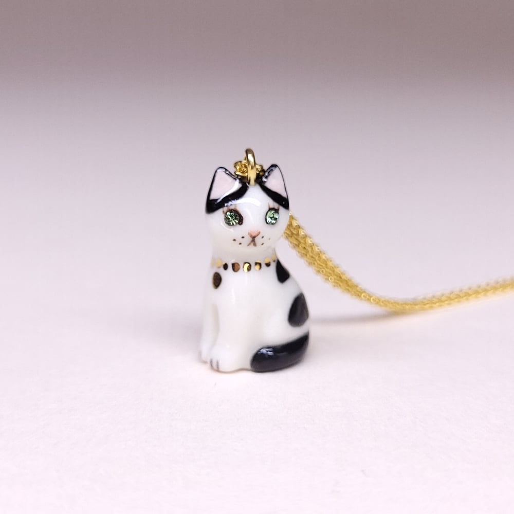 Image of Cow Cat Porcelain & Gold Vermeil Sitting Kitten Pendant