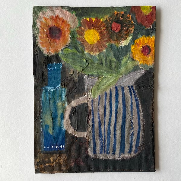 Image of striped jug with hot summer flowers