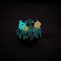 Image 17 of Glow in dark orange cat in witch brew cauldron ceramic keepsake (rainbow effect)